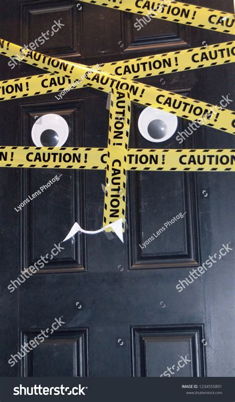 Vertical Caution Tape Halloween Door Decoration Stock Photo 1234555891