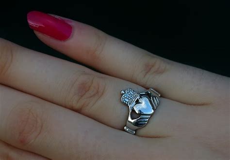 The wedding ring goes on the left hand, the ring finger. SilentOwl: The Claddagh Ring. The Irish Wedding Ring.