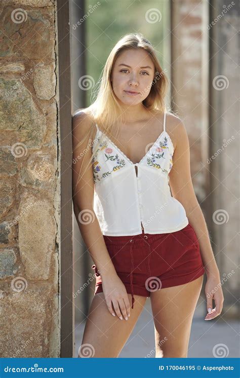 Stunning Young Latina Woman Poses In Red Shorts Desert Stock Image