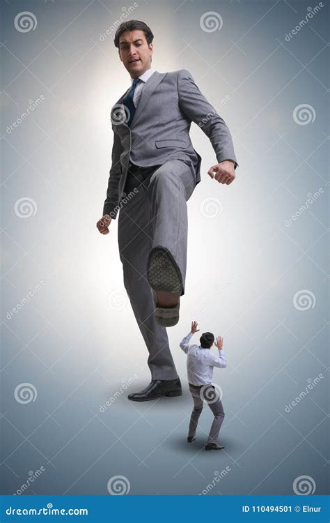 The Bad Angry Boss Kicking Employee In Business Concept Stock Image