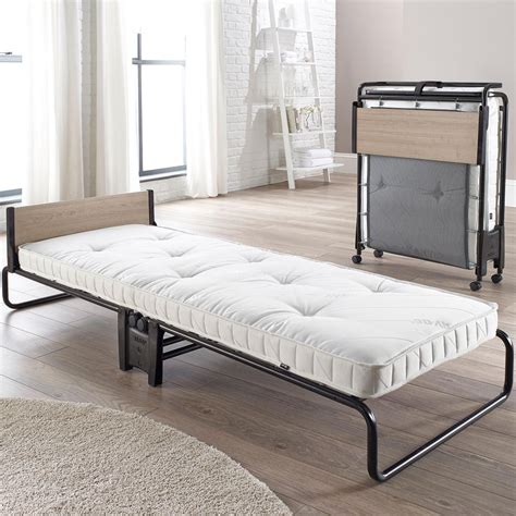 A Folding Guest Bed With A Memory Foam Mattress Which Works In Harmony