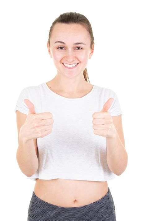 Premium Photo Beautiful Young Woman In Sports Wear Showing Ok Sign Thumbs Up Looking Camera