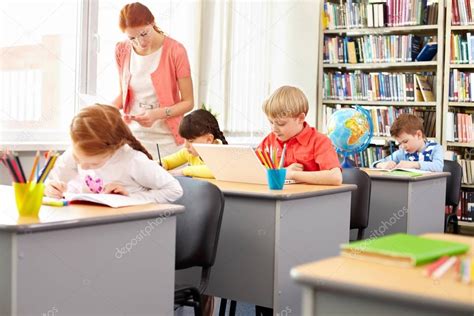 School Kids Busy With Schoolwork — Stock Photo © Pressmaster 130590094