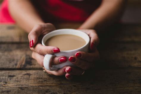 Women Holding Cup Of Coffee · Free Stock Photo