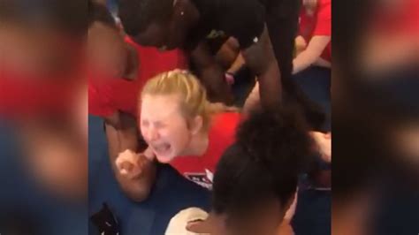 Coach Fired After Video Shows Cheerleader Screaming In Pain During
