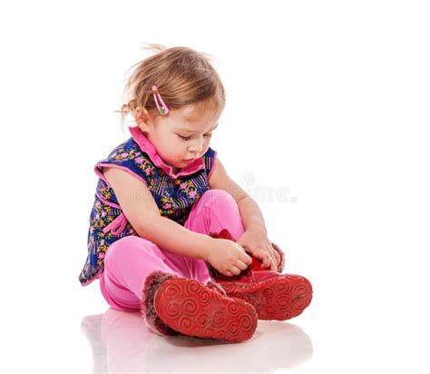 Toddler Putting On Shoes Stock Photo Image Of Sitting 105350230