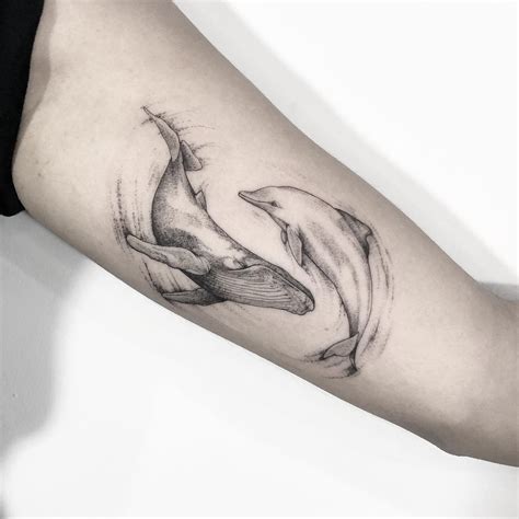 delve into the beauty of dolphin tattoos explore 40 mesmerizing designs for men