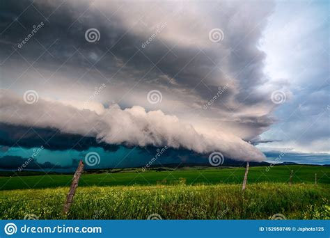 Storm Clouds Over A Green Grass Field Stock Image Image Of Black