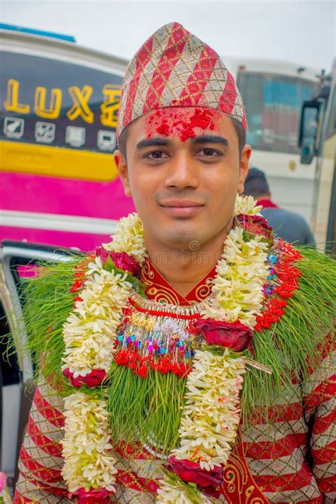 pokhara nepal october 10 2017 portrait of a handsome man wearing flowers around his neck and