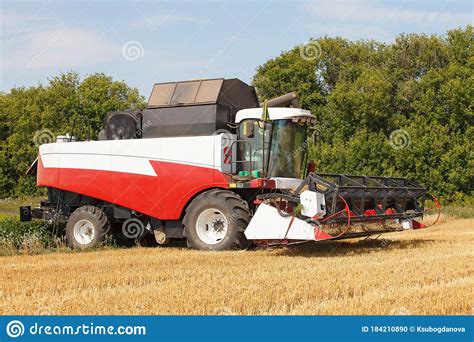 Combine Harvester Working In A Wide Wheat Field Stock Photo Image Of