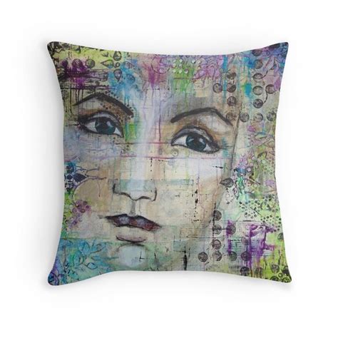 A Decorative Pillow With An Image Of A Woman S Face