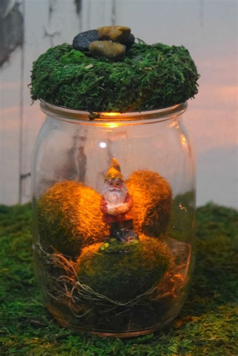 We created this photo wall purely as a test and stumbled across something great! DIY Light Up Gnome Mason Jars | The TipToe Fairy