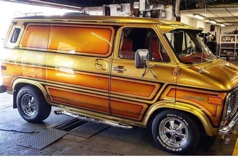 An Orange Van Is Parked In A Garage