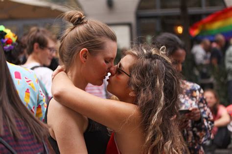 Two Girls Embracing And Kissing At The Annual Pride Parade Lgbt Impressions From Gay And