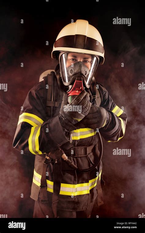 Firefighter With Mask And Protective Suit Stock Photo Alamy