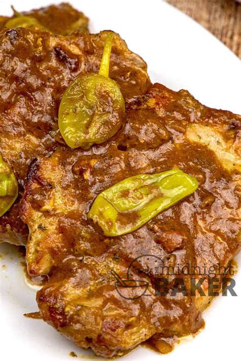 Slow cooker pork chops are tender, juicy and smothered in a mouthwatering gravy! Slow Cooker Mississippi Pork Chop Recipe | FaveSouthernRecipes.com