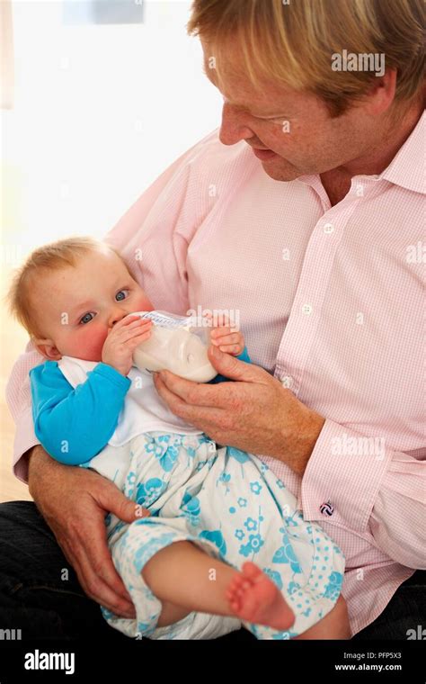 Baby Holding Bottle 11 Hi Res Stock Photography And Images Alamy