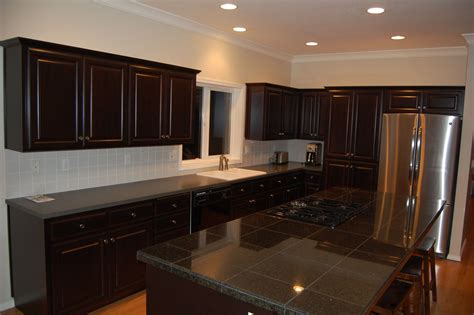 You may want to choose cabinet refinishing. Cabinet Refinishing: Dark Walnut | Stained kitchen ...