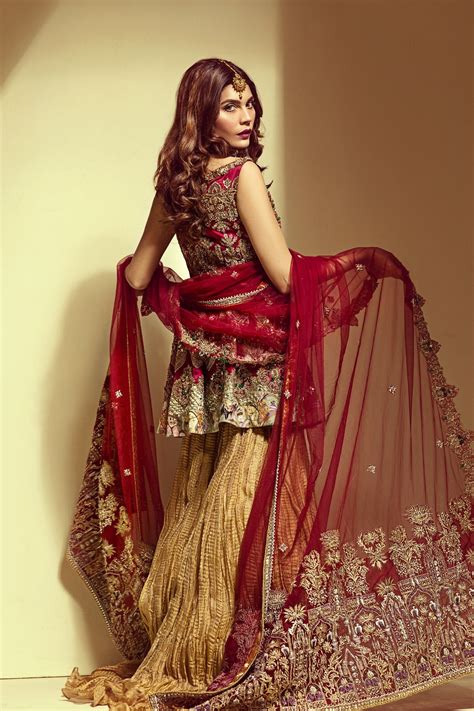 Golden Sharara With Sleeveless Pink Bridal Blouse And A Net Embroidery