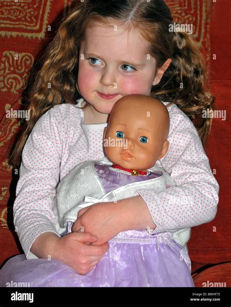 Girl With Toy Doll Hi Res Stock Photography And Images Alamy