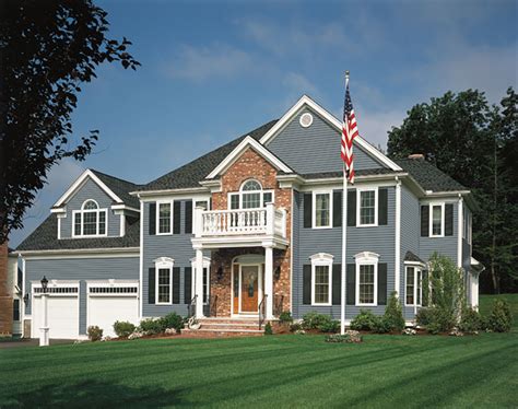 The color family created with the brick, door, trim and gutters is also balanced. 7 Stunning Blue House Siding Ideas - Allura CMS