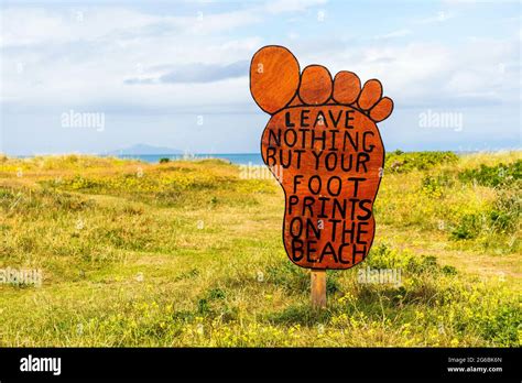 Anti Pollution Sign In The Shape Of A Foot On The Access Path To The