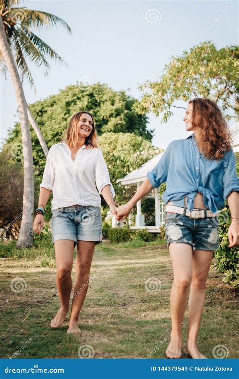 Happy Lesbian Couple Walking In The Garden At Their Country House Stock Image Image Of