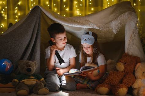 Little Children Reading Bedtime Story At Home Stock Photo Image Of