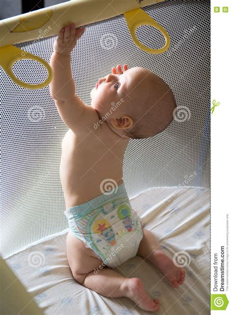 Baby In A Diaper In Playpen Stock Image Image Of People Close 76598507