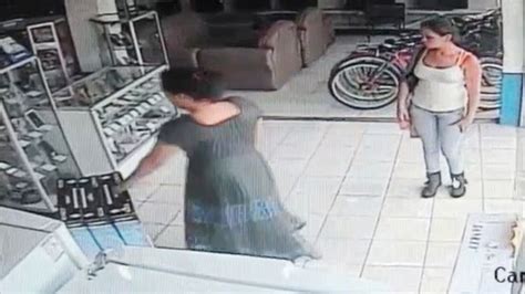 Cctv Captures Bizarre Shop Theft As Woman Steals Plasma Tv By Stuffing It Up Her Skirt Mirror
