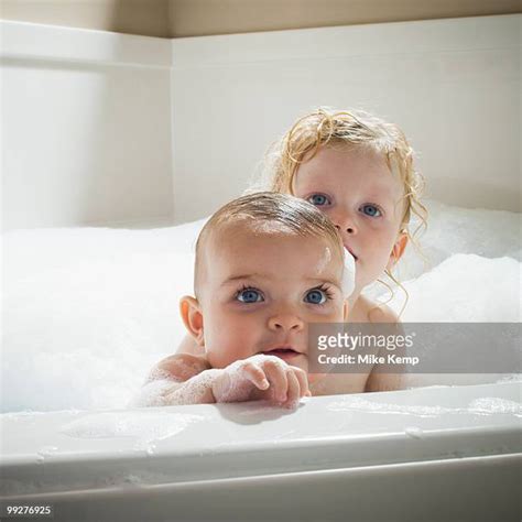 Brother And Sister Taking A Bath Together Photos Et Images De