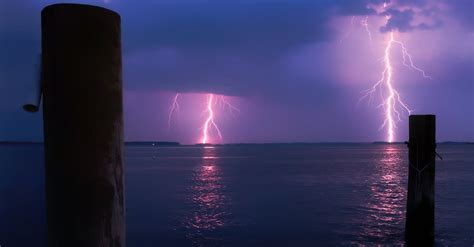 Lightning Over Sea Against Storm Clouds · Free Stock Photo