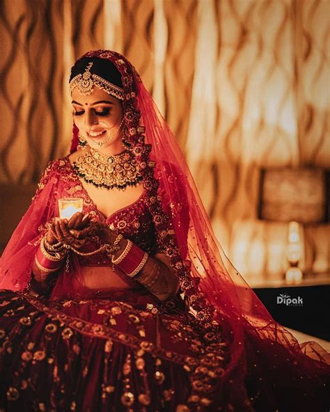Beautiful Bride In A Classic Red Lehenga Indian Bridal Photos Bride Photography Poses Bridal