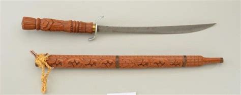 Lot Of Two Decorative Swords Including A Modern Carved South Pacific