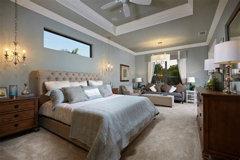 Transitional Master Bedroom With Chandelier Pendant Light Ceiling Fan
