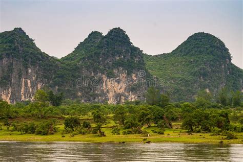 Karst Mountain Grouip With Cliffs Along Li River In Guilin China Stock