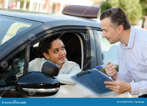 Young Woman On Driving Test With Instructor Stock Photo Image Of