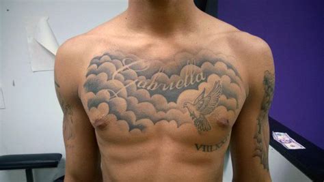 man with clouds tattoo on chest chest tattoo men cool chest tattoos chest tattoo