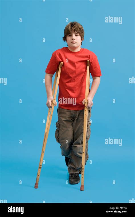 Adolescent Male Using Crutches Stock Photo Alamy