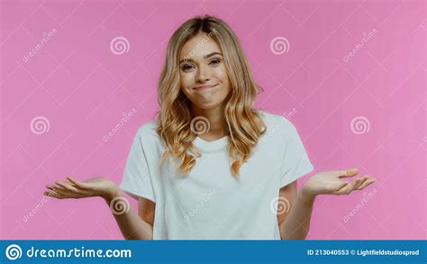 Confused Blonde Woman Showing Shrug Gesture Stock Image Image Of Emotion Tshirt