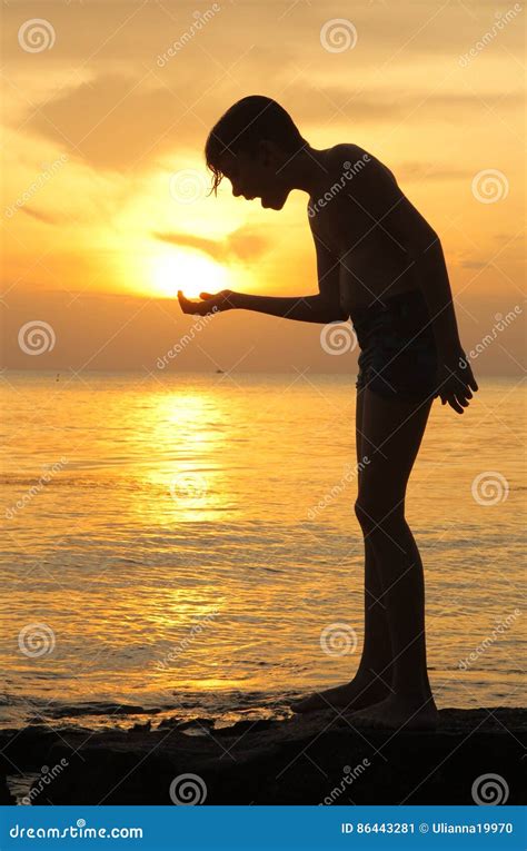 Teen Boy Silhouette On Sea Ocean Sunset Stock Image Image Of Nature