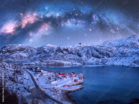 Milky Way Above Sea Coast Snow Covered Mountains Village With Red