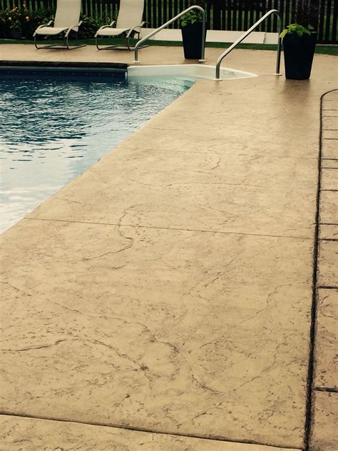 Stamped And Colored Concrete Pool Deck With Custom Chiseled Stone Cantilevered Coping By Sierra