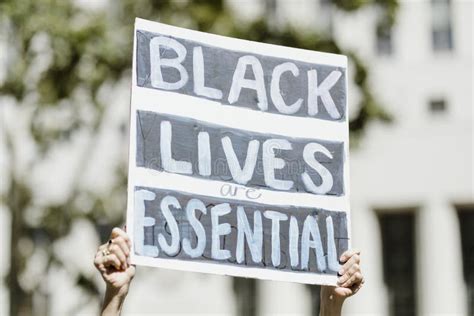 Black Lives Are Essential Board At A Blm Protest In La Editorial Image