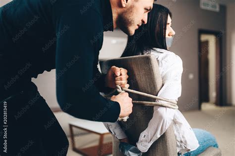 Robber Maniac Tied Female Victim To A Chair Stock Photo Adobe Stock