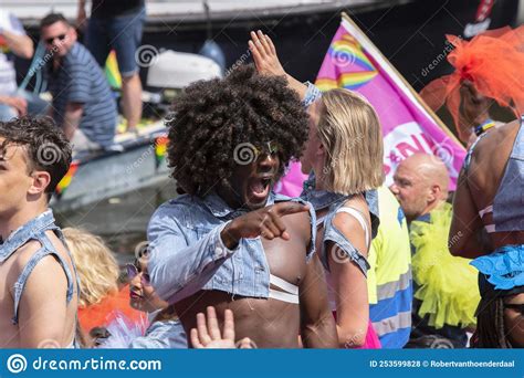close up pink nieuw west boat at the gaypride canal parade with boats at amsterdam the