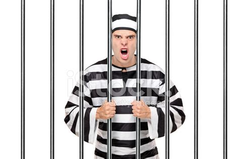 Angry Prisoner Standing Behind Bars Stock Photo Royalty Free Freeimages