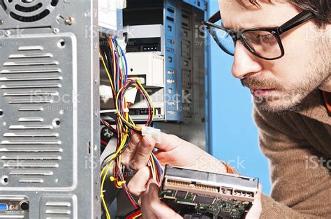 Man Fixing Computer Stock Photo Download Image Now Istock