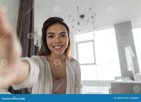 Beautiful Girl Taking Selfie Portrait Photo In Bedroom In Morning Stock