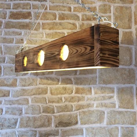 Commercial wood ceilings from armstrong ceiling solutions include wood ceiling panels, planks woodworks ceilings are an excellent alternative to custom millwork that can prove to be. long ceiling light light pendant wooden light fixture wood